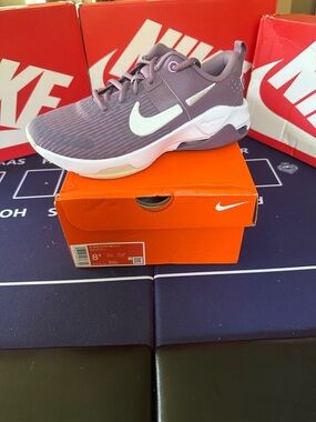 Nike Lavender/Purple Athletic Shoe with White Swoosh